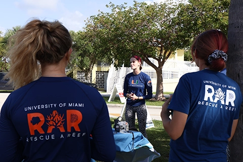 Image shows the Rescue a Reef team circled up and preparing for a talk